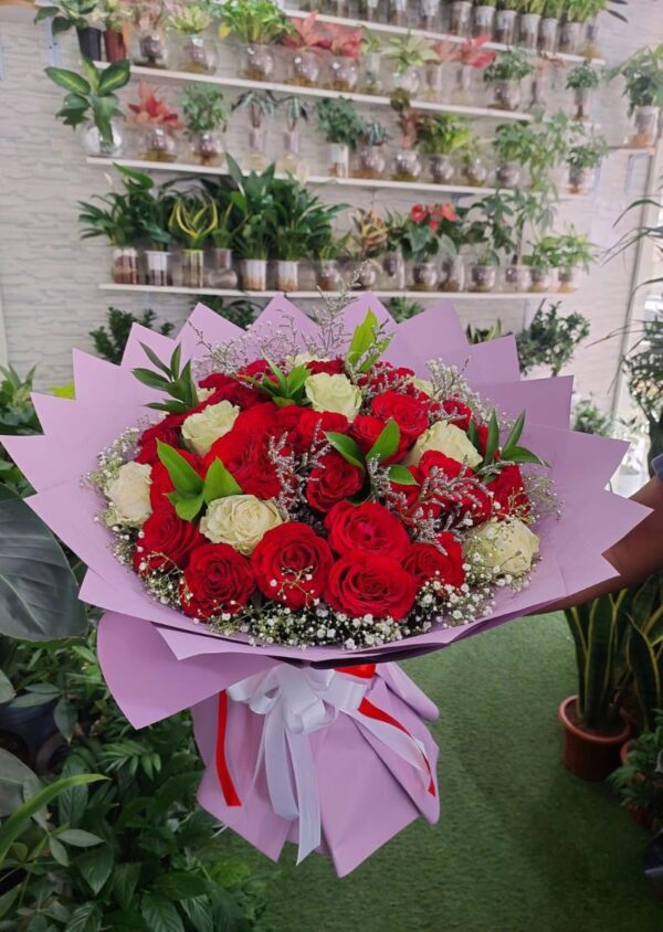 Red and white mix rose bouquet featuring fresh, vibrant roses arranged in a stunning floral arrangement. Perfect for special occasions and celebrations.