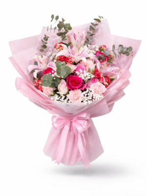 Elegant birthday bouquet with pink lilies and pink roses wrapped in premium paper