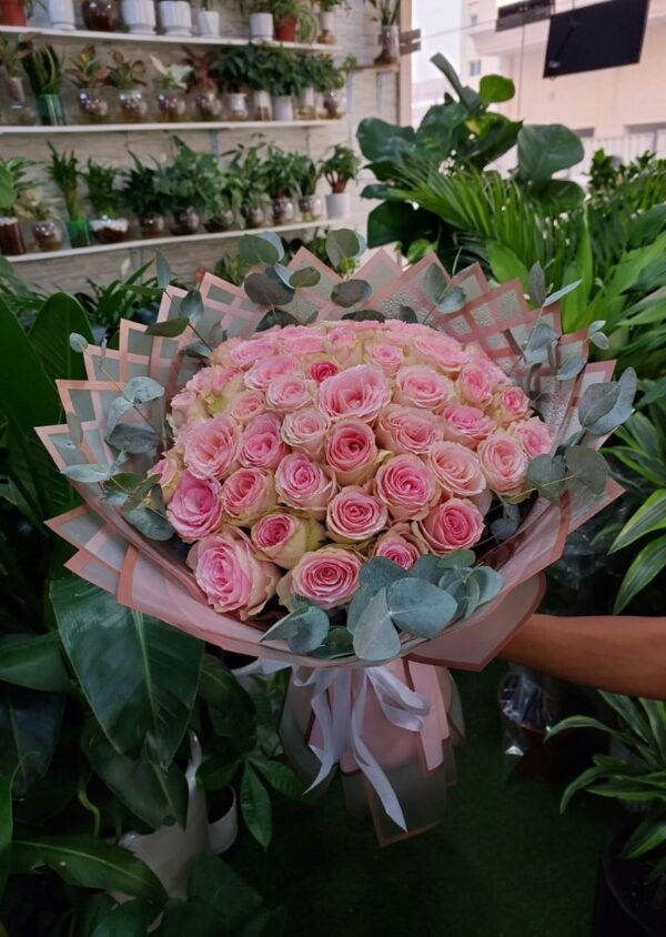 Beautiful pink roses bouquet with eucalyptus, best choice for birthday celebrations.