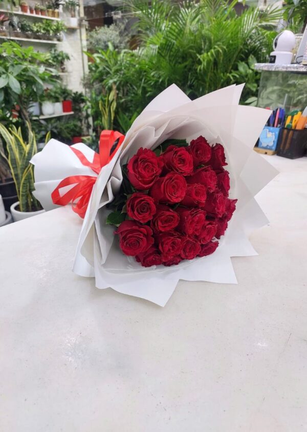 21 Red Roses Bouquet – Freshly Wrapped with White Paper and a Red Ribbon for Special Occasions in Dubai