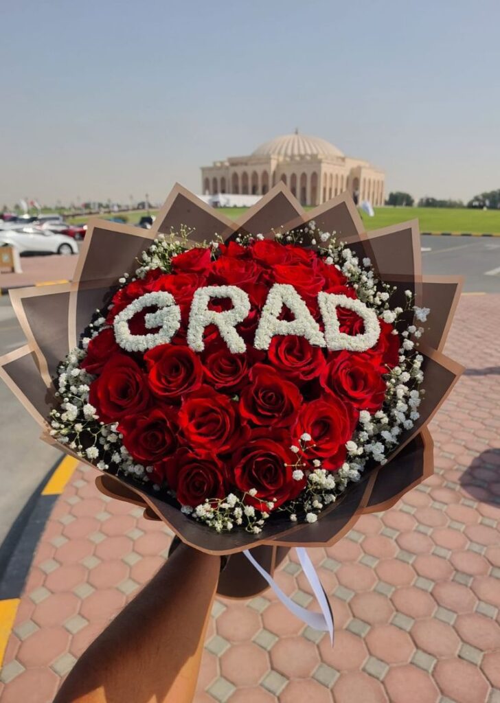 GRAD red rose bouquet for graduation at University City Hall Sharjah