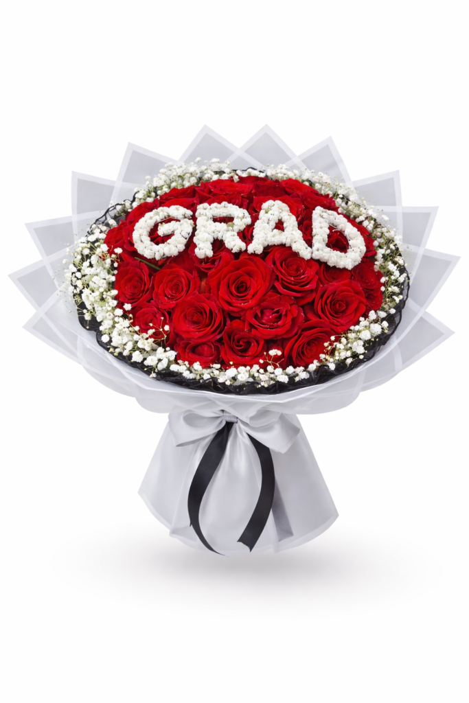 Luxury graduation flowers delivery sharjah with red roses and white baby’s breath spelling GRAD