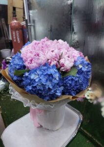 Luxury peonies and exotic flowers bouquet hand-wrapped for premium flower delivery in Dubai