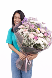 Luxury pastel flower bouquet handcrafted by professional florist with fresh roses and carnations