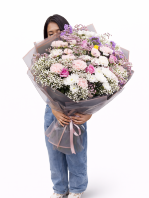 Luxury pastel flower bouquet handcrafted by professional florist with fresh roses and carnations