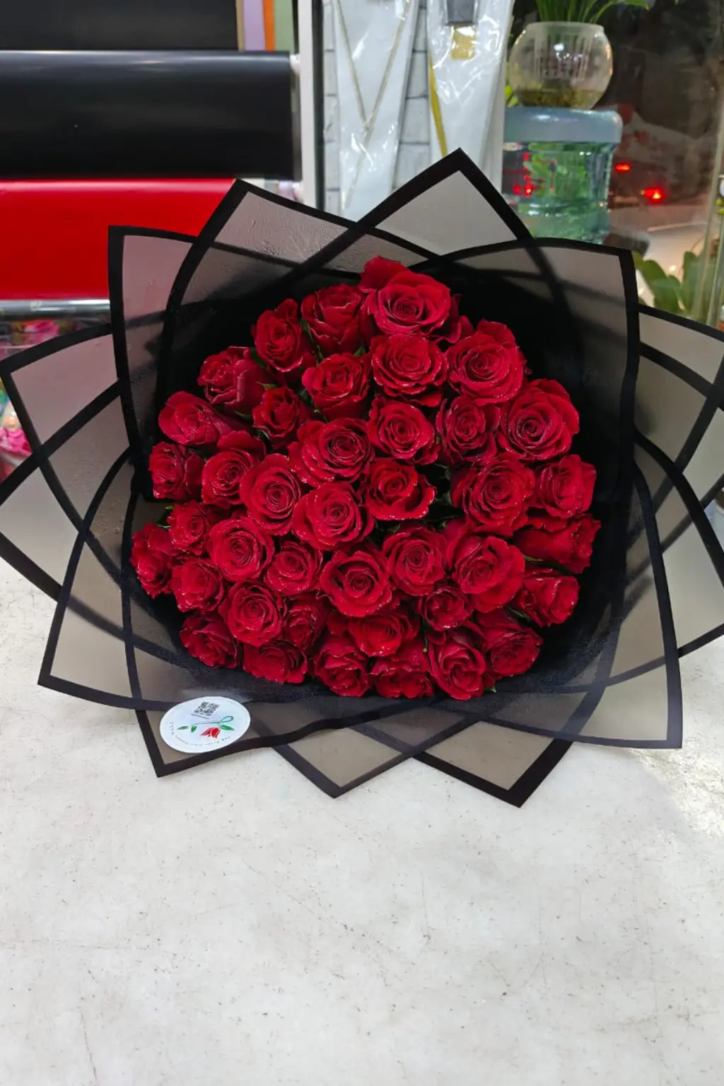 Affordable red roses bouquet gift-wrapped and ready for same-day delivery in UAE