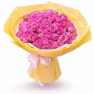 Vibrant mixed floral bouquet with premium pink roses wrapped in elegant yellow paper