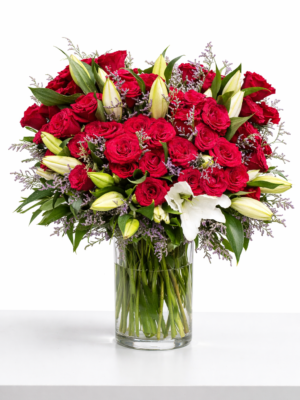 Luxury red roses & white lily bouquet in glass vase for premium flower delivery in Dubai