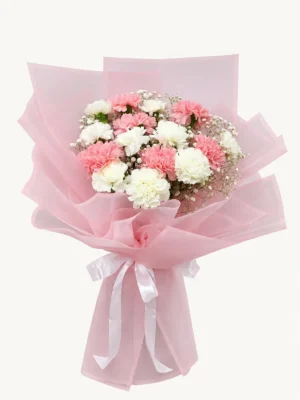 Image ALT Text: Pink and white carnation flower bouquet with baby’s breath and pink wrapping