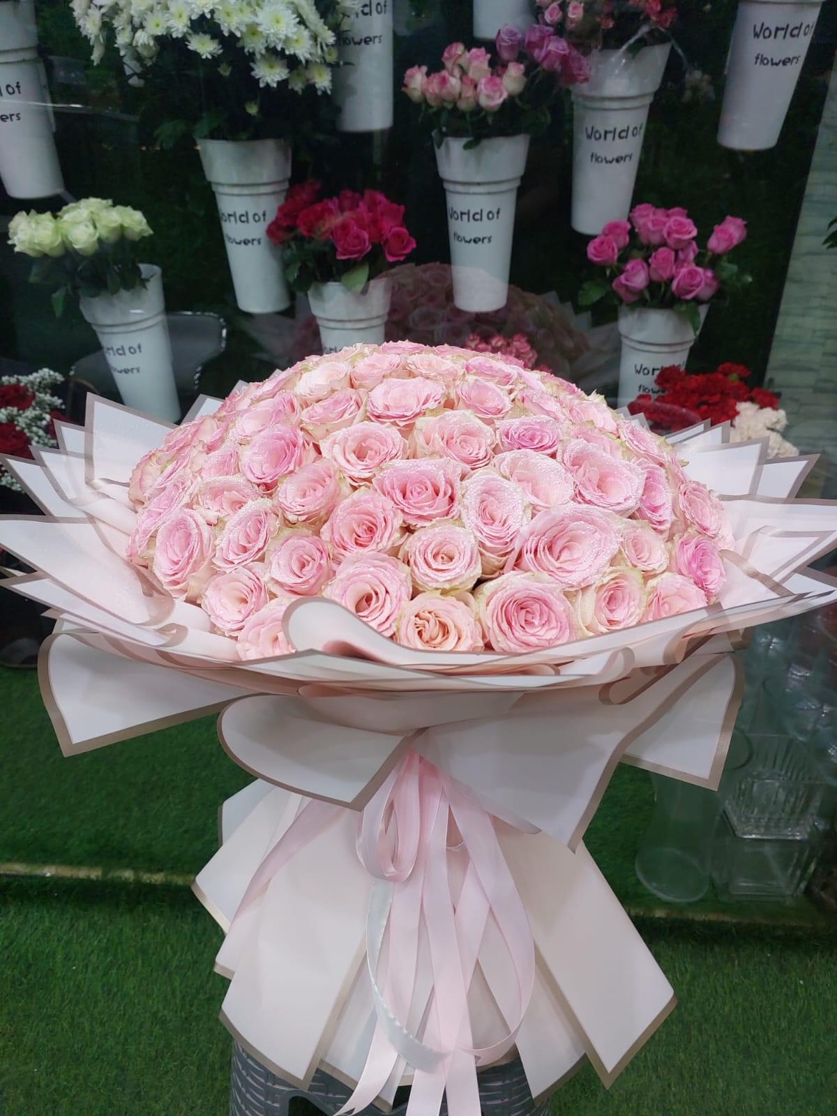 Exquisite arrangement of 101 light pink roses - perfect for weddings, anniversaries, and special occasions.