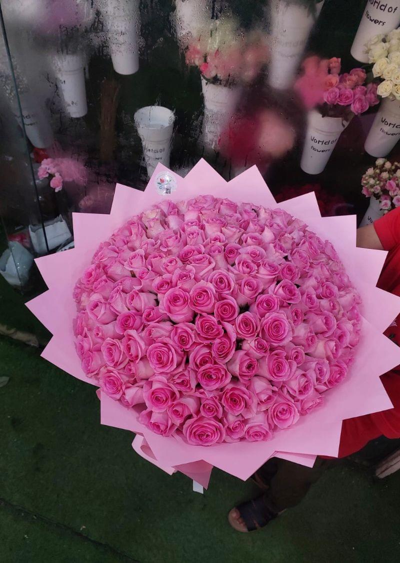 Beautiful hand-tied pink roses bouquet with premium wrapping, available for flower delivery in Sharjah and Dubai from The Green Plant Flowers.